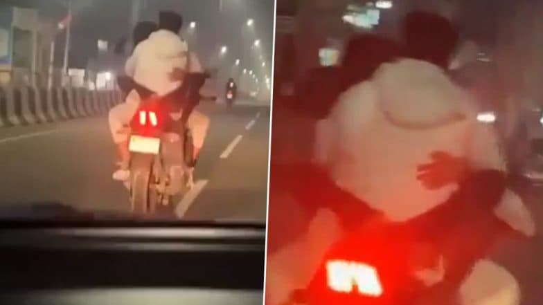 Couple Romances on Bike: బైక్‌పై జంట రొమాన్స్ వీడియో ఇదిగో, ట్యాంకర్ మీద ప్రియురాలు కూర్చుంటే బైక్ నడుపుతూ ముద్దులు పెట్టిన ప్రియుడు