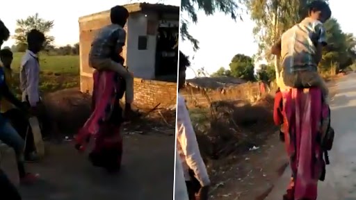 MP Woman Shamed: మహిళపై దారుణం, మూడు కిలోమీటర్లు వ్యక్తిని మోసుకుంటూ వెళ్లాలని హుకుం జారీ చేసిన గ్రామస్తులు, మధ్యప్రదేశ్లో ఆటవిక చర్య, కేసు నమోదు చేసిన పోలీసులు MP Woman Shamed: మహిళపై దారుణం, మూడు కిలోమీటర్లు వ్యక్తిని మోసుకుంటూ వెళ్లాలని హుకుం జారీ చేసిన గ్రామస్తులు, మధ్యప్రదేశ్లో ఆటవిక చర్య, కేసు నమోదు చేసిన పోలీసులు