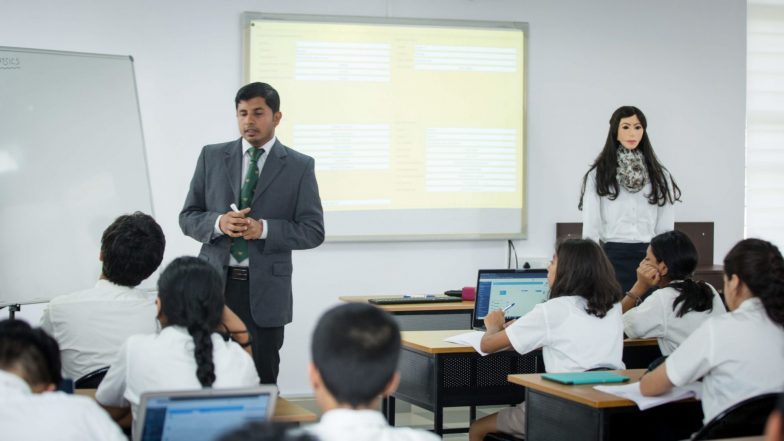 Robot Teacher: కొత్తపుంతలు తొక్కుతున్న టెక్నాలజీ, టీచర్లుగా రోబోలను రంగంలోకి దించిన స్కూల్, హైదరాబాద్లో వినూత్న ప్రయోగం, 30 భాషల్లో బోధించనున్న రోబో టీచర్లు Robot Teacher: కొత్తపుంతలు తొక్కుతున్న టెక్నాలజీ, టీచర్లుగా రోబోలను రంగంలోకి దించిన స్కూల్, హైదరాబాద్లో వినూత్న ప్రయోగం, 30 భాషల్లో బోధించనున్న రోబో టీచర్లు